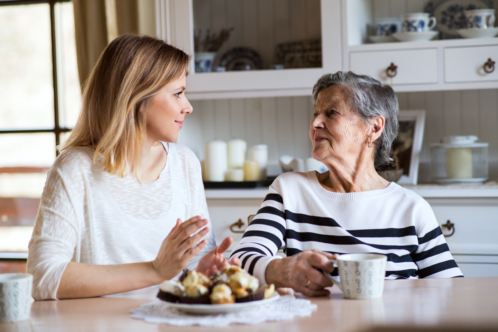 young-woman-senior-chatting Young woman and Senior Chatting