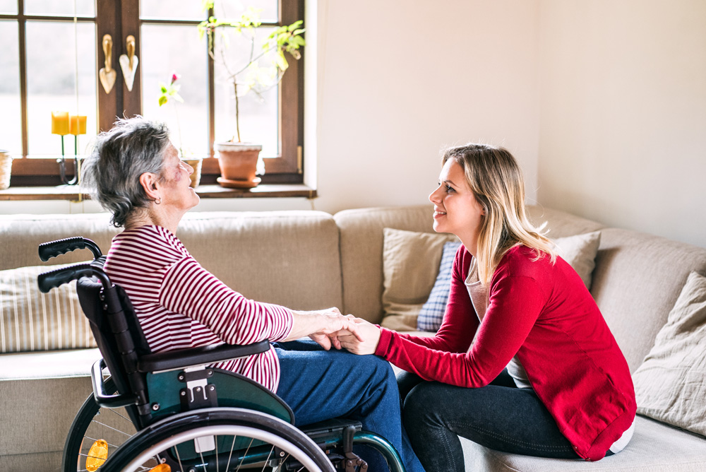 young-woman-senior-in-wheelchair Young Woman and Senior in Wheelchair