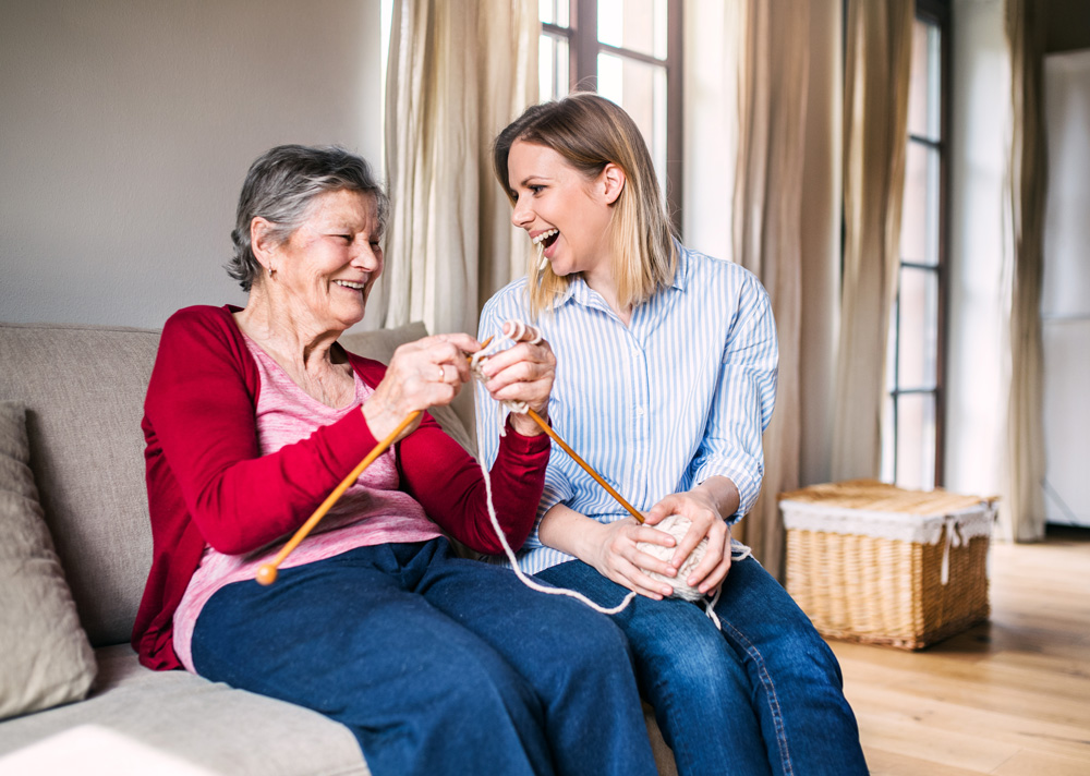 Young Woman and Senior Knitting